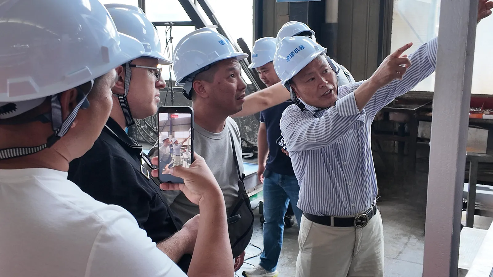 Kyrgyz visitors in the SREE assembly shop